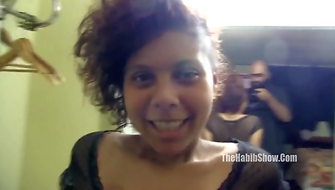 Ebony sex slut with a long hair is giving a blowjob