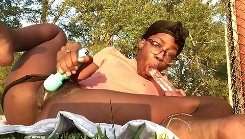 Ebony beauty smoking herself and playing with her pussy