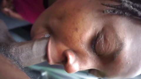 Ebony chick enjoys eating a big black cock deep throat