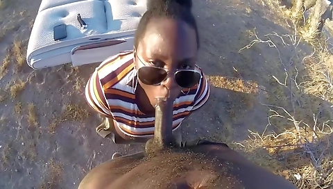 Ebony brunette gets a creampie on her back in outdoor porn