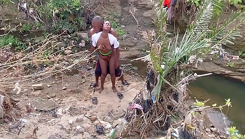 Bright ebony brunette with a cute face is taking a shower