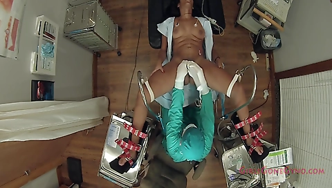 Ebony brunette gets examined by a doctor in the gym