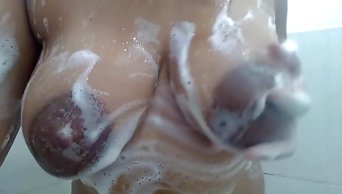 Sexy ebony milf in her black boots makes her shower