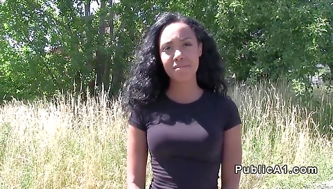 A tattooed ebony girl flashes her big ass in front of the camera