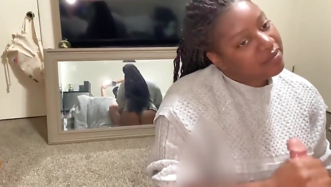 Brunette ebony milf in her g-string sucks a white dick