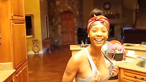 Busty ebony slut with big boobs shows off her tits