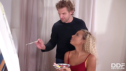 Busty black chick with tattoo is having fun with a black dick